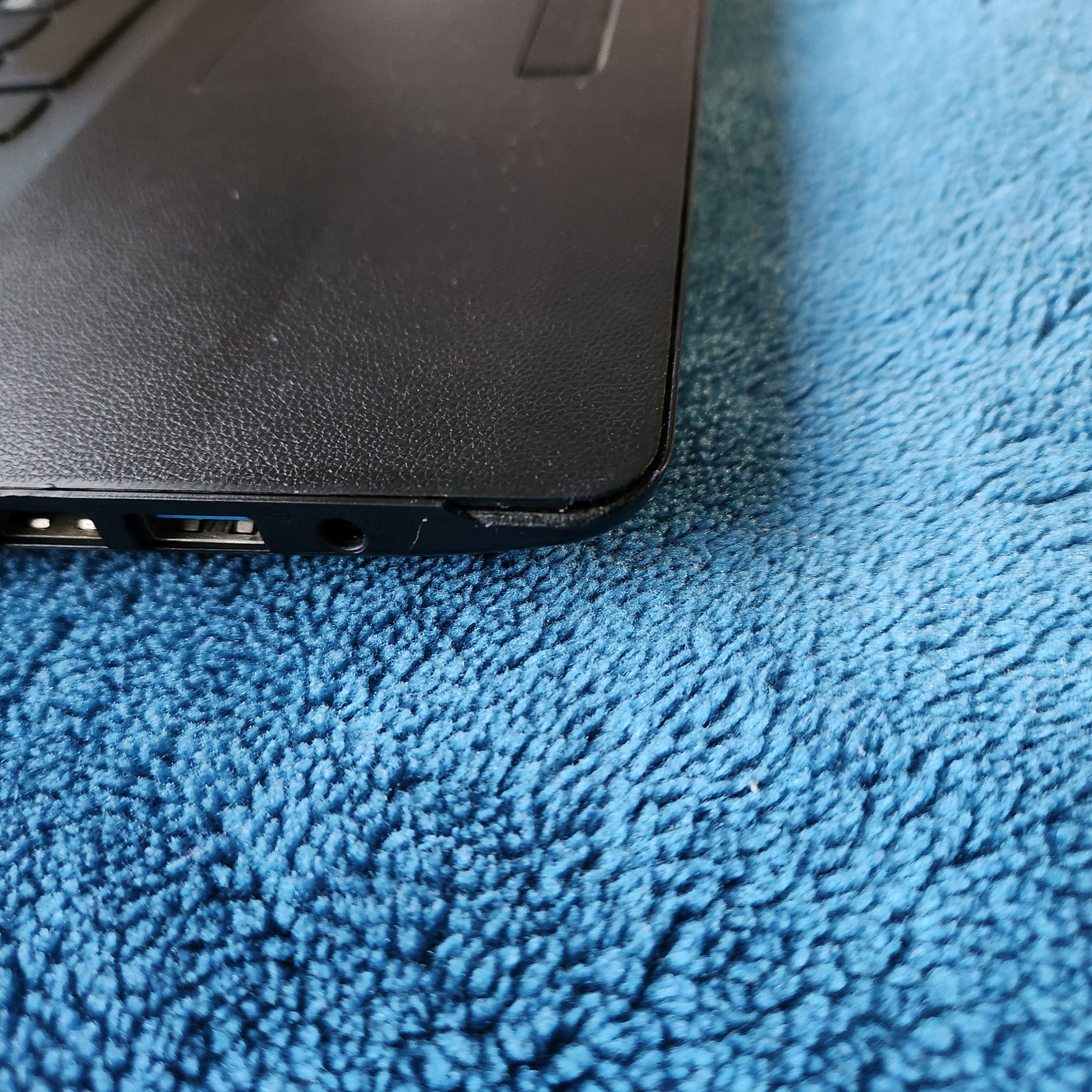 Small chip on left bottom corner